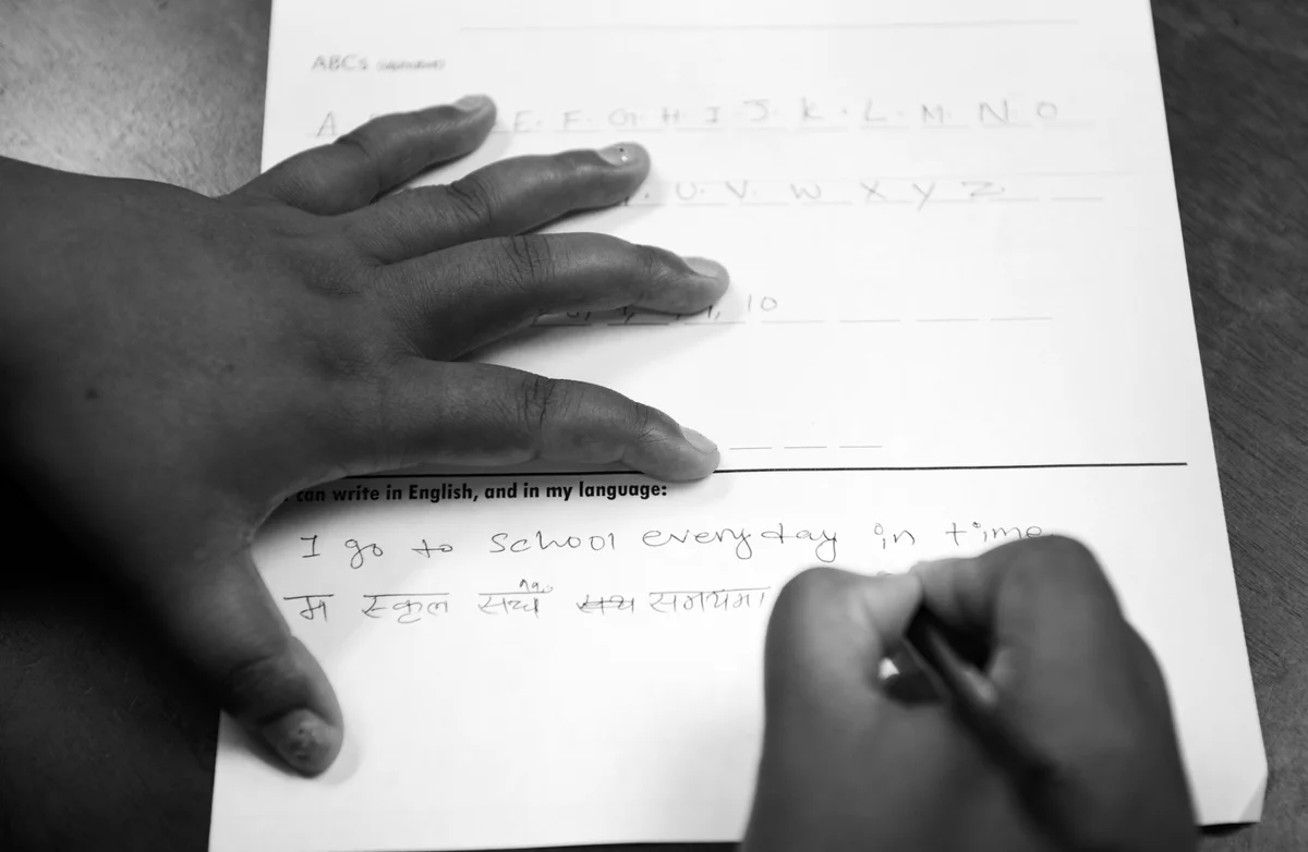 August 1, 2017. Kheena Gurung takes a test in downtown Pittsburgh to determine her English proficiency. The test is used for placement in English classes. Her husband also took the test, but her mother, who does not read or write, was not able to do so. Kheena and her husband are now enrolled in English classes. © Scott Goldsmith/TDW 2017