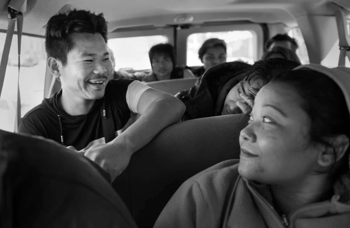 Som is riding a van that will take him to work with about 15 other immigrants and refugees from the Pittsburgh area. All of these people are driven to Spears, PA where they work from 4 p.m. to 2 a.m. packing frozen meat for wholesale. © Scott Goldsmith/TDW 2017