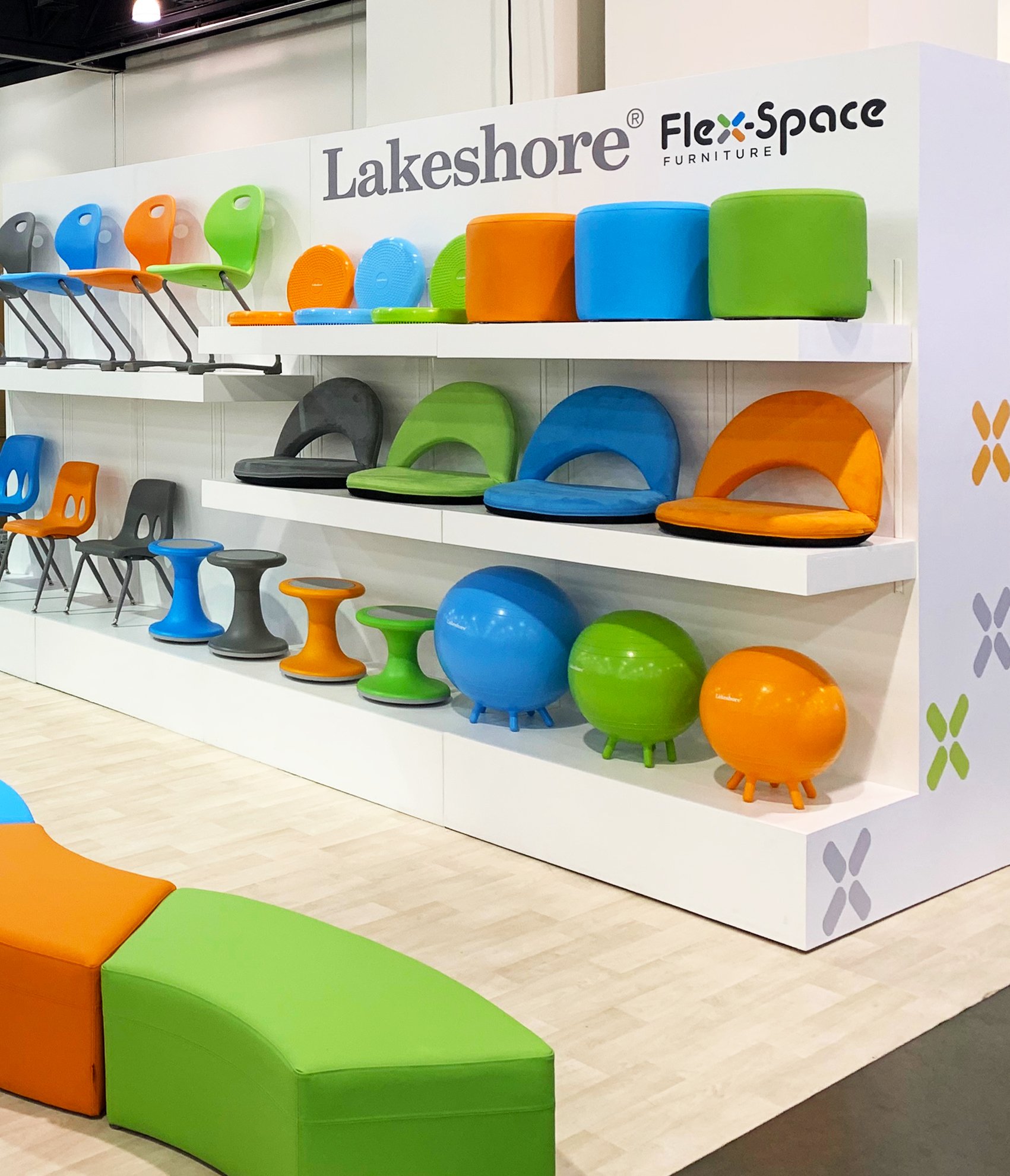  The design of our “Chair Wall” allowed us to elevate our new Flex-Space seating into art, while providing a visual focal-point for the booth, and increasing the amount of displayable product  