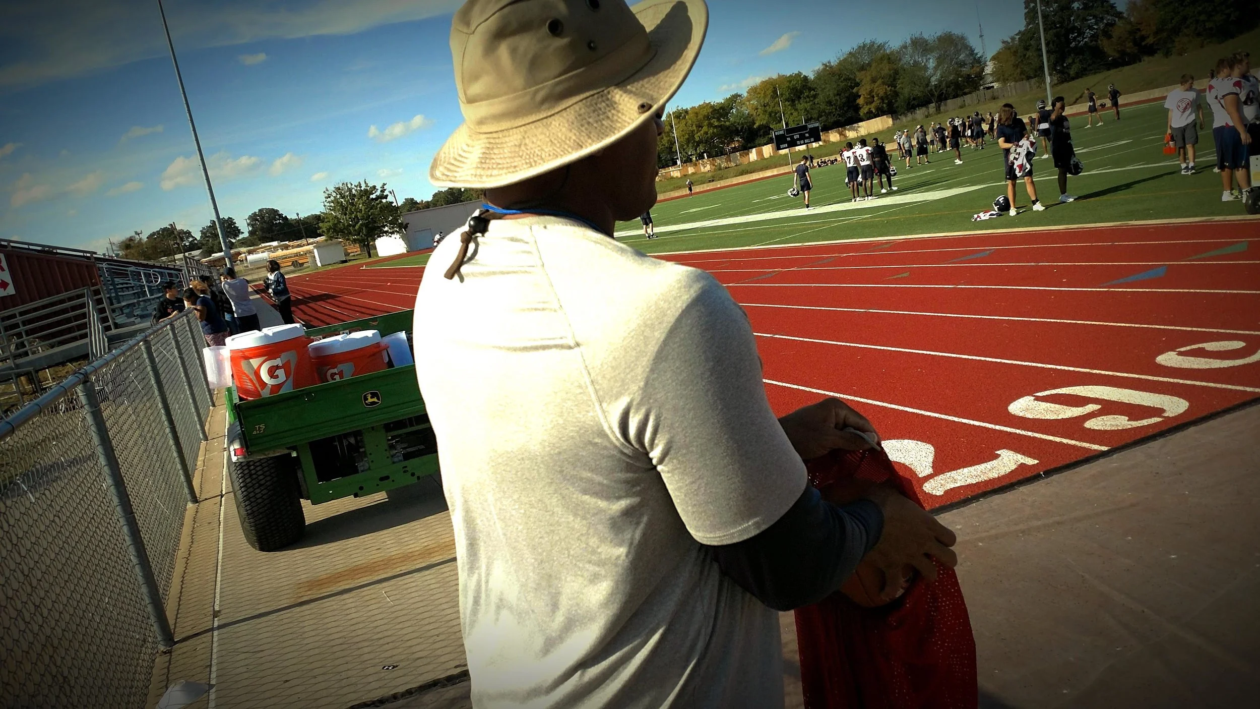 Photo of Cobbs coaching Ryan’s football team. Photo by Jordan Brown.