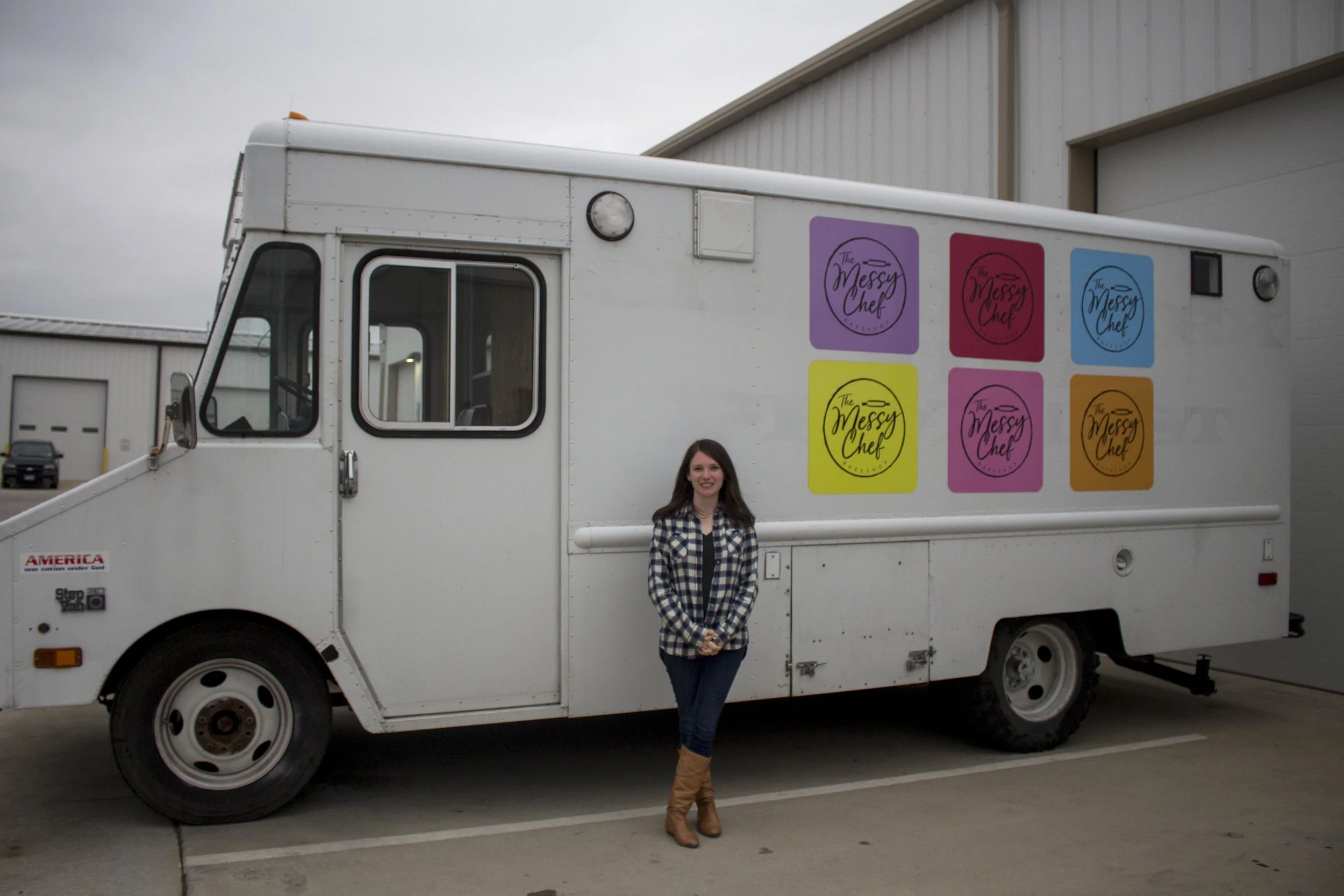 Williams standing outside her truck, the Messy Chef.