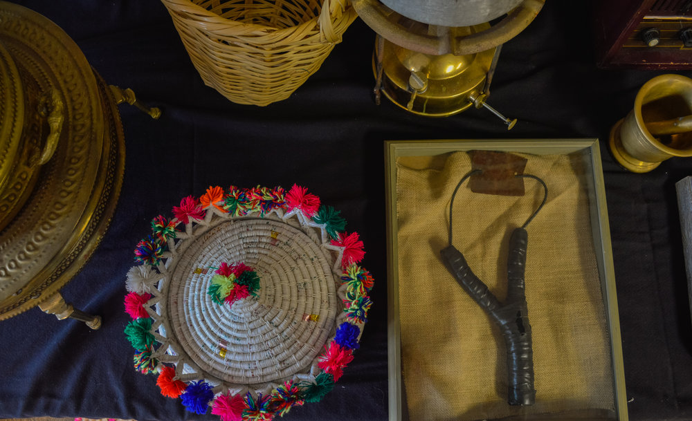   Artifacts on display at Broken Film Festival, including a slingshot and a basket for bread 