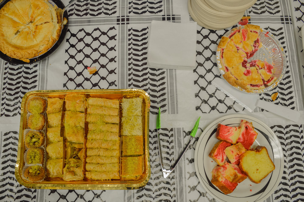  Some of the many offerings of Israeli/Palestinian food found at the Broken Lens Film Festival. Desserts included a blend of pistachios, fruit, and coconut 