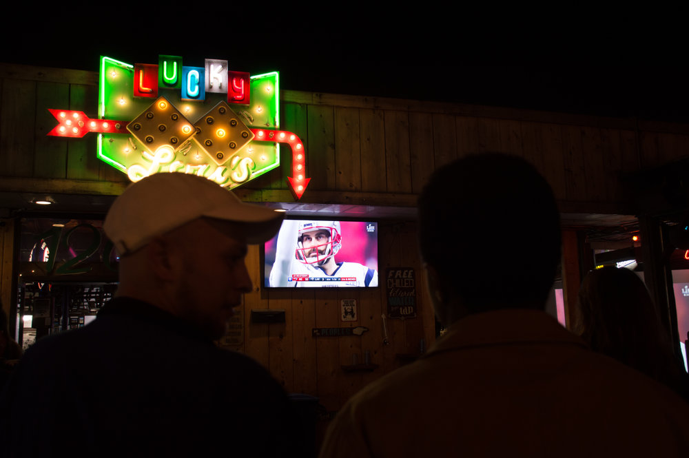  Fans watching the game outside at Lucky Lou’s. 