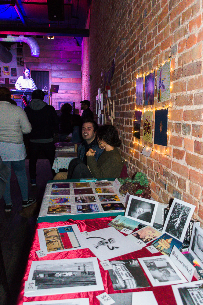  Tables were lined across Andy’s wall to show different artists work - either postcards, prints, photographs, stickers, etc were all seen on the tables for purchase. 
