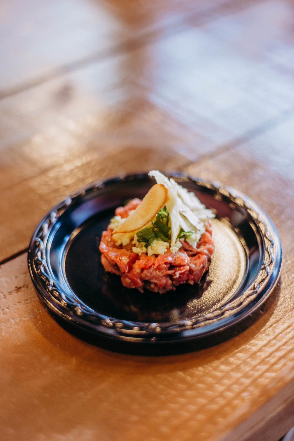  The first course - Beef Tartar with Herbs and Boiled Egg paired with Red Dragon Cheese. Photo by Jennifer Meza. 