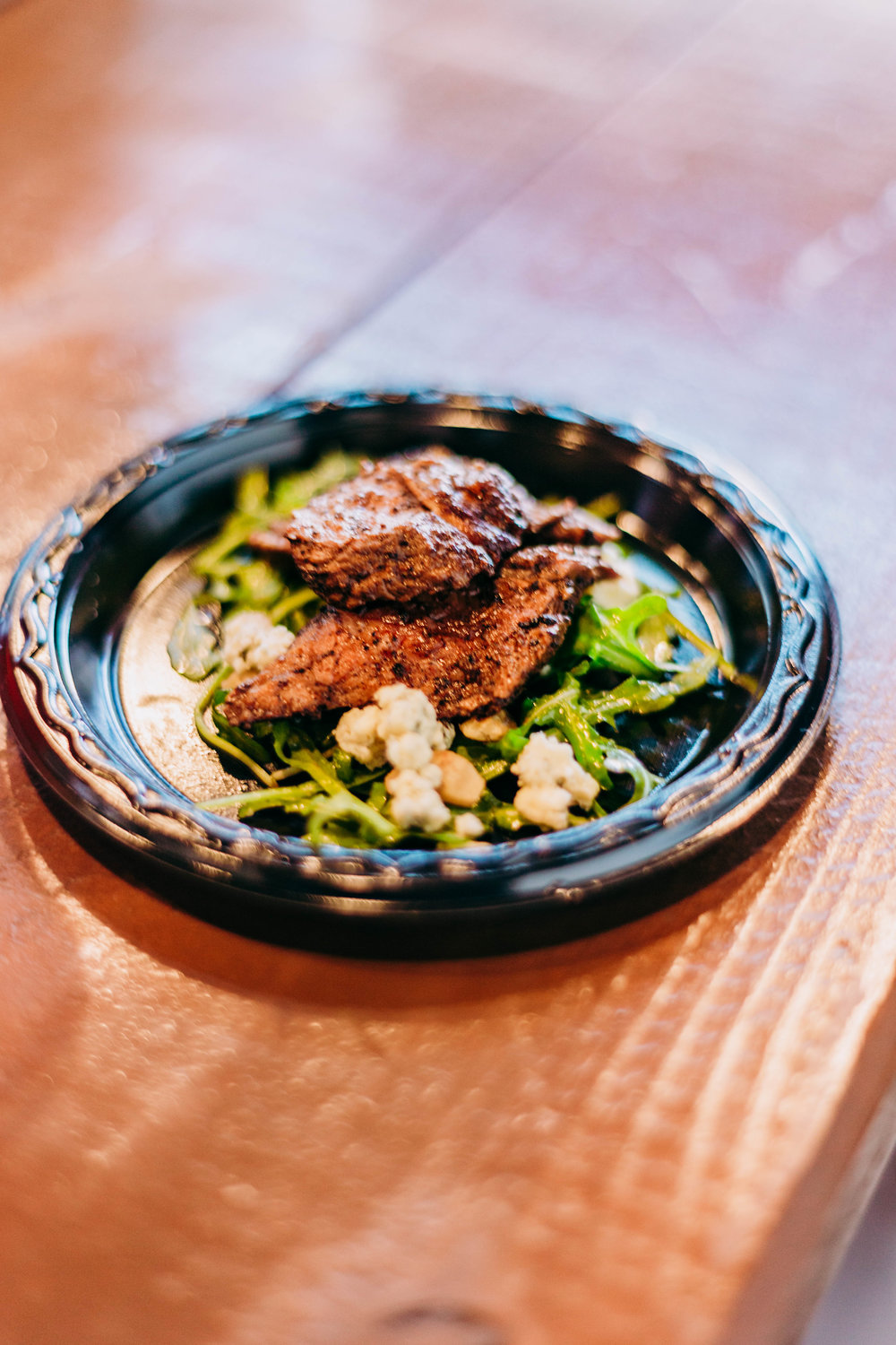  The second course: Steak Salad with Walnuts, Citrus Dressing, and Foir D’Avancio Cheese. Photo by Jennifer Meza. 