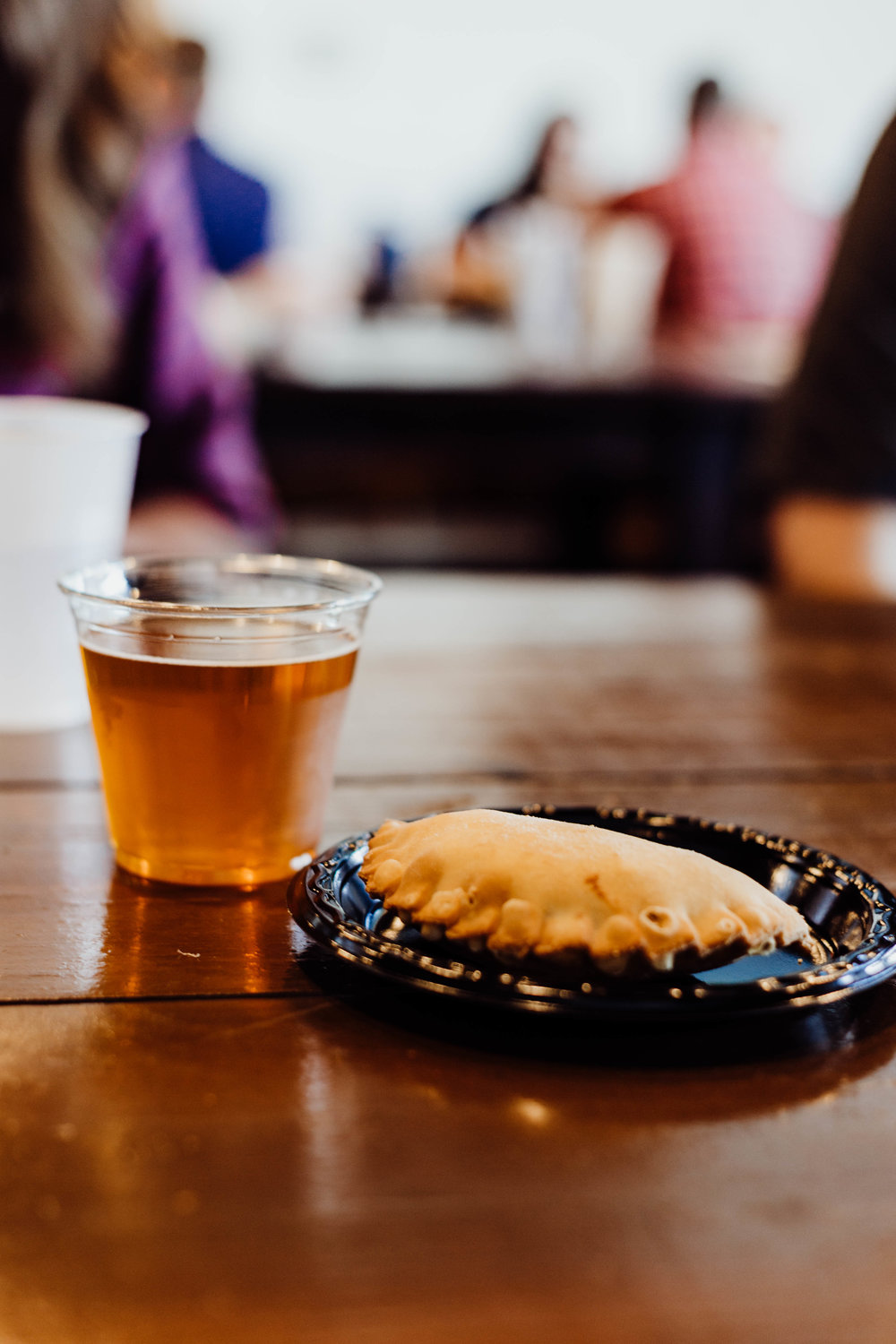  The fourth course, featuring a Sausage, Onion and Potato Empanada with Smoked Habanero Cheese and the Greenbelt Farmhouse Ale. Photo by Jennifer Meza. 