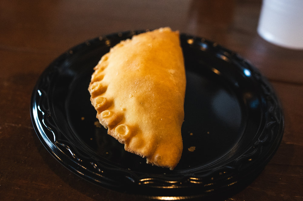  The fourth course, featuring a Sausage, Onion and Potato Empanada with Smoked Habanero Cheese. Photo by Garrett Smith. 