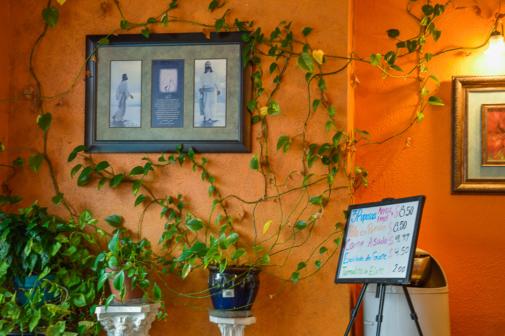  Guatelinda decor - Spanish menu and Catholic imagery on the walls. 