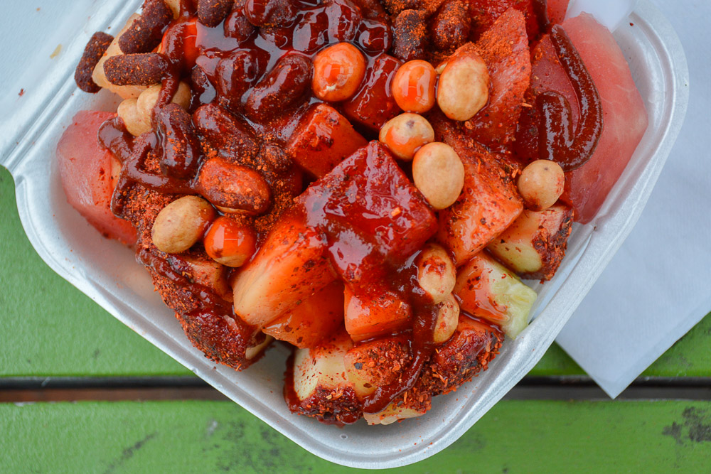  A plate of fruit - apple, watermelon, melon and pineapple, with hot sauces and nuts is an option at Antojitos. 