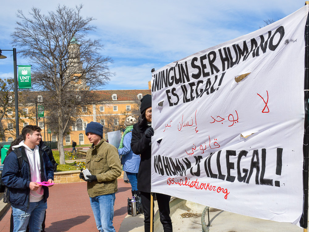  Close up of signs, UNT in the background. 