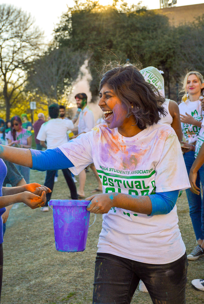  Attendees spreading the love and spirit of Holi via buckets of powder. 