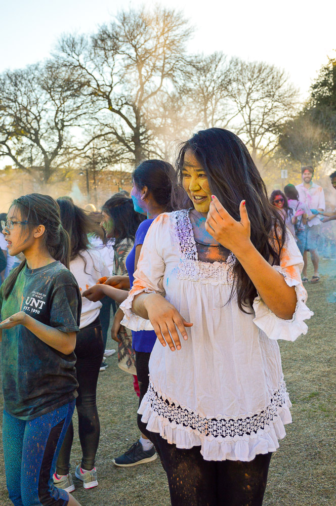  Attendees spreading the love and spirit of Holi via buckets of powder. 