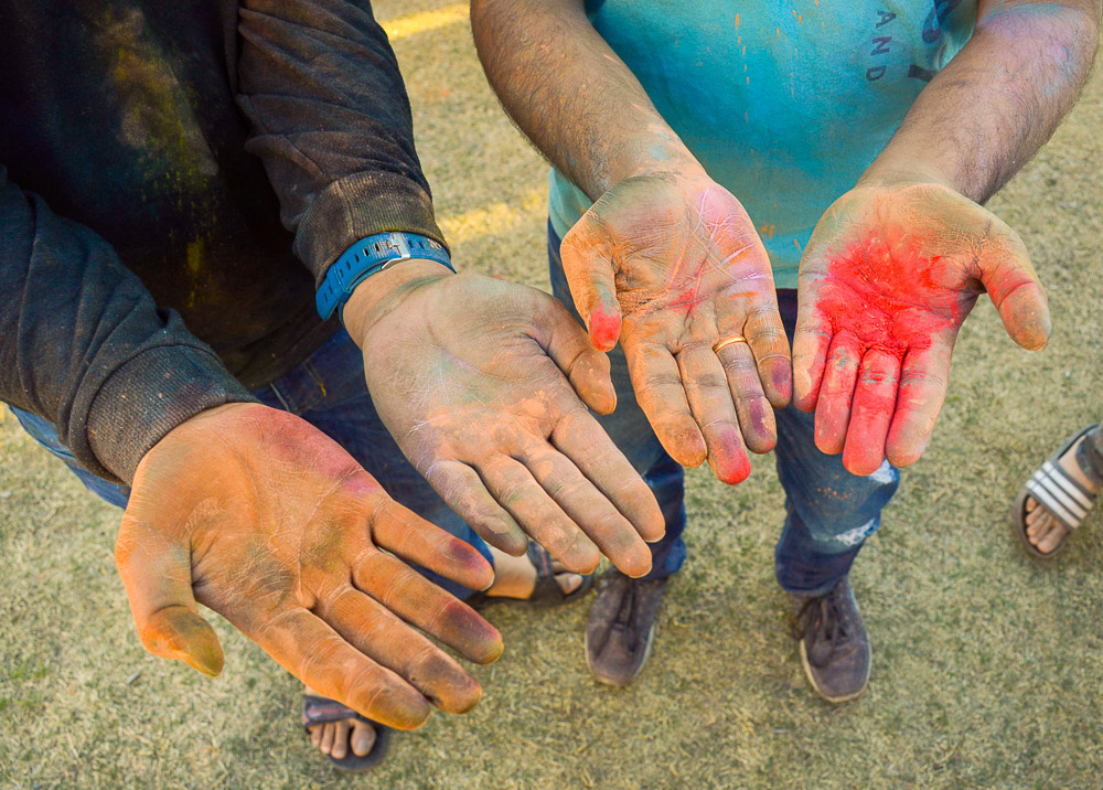  Close-up of the aftermath of powder on peoples’ hands. 