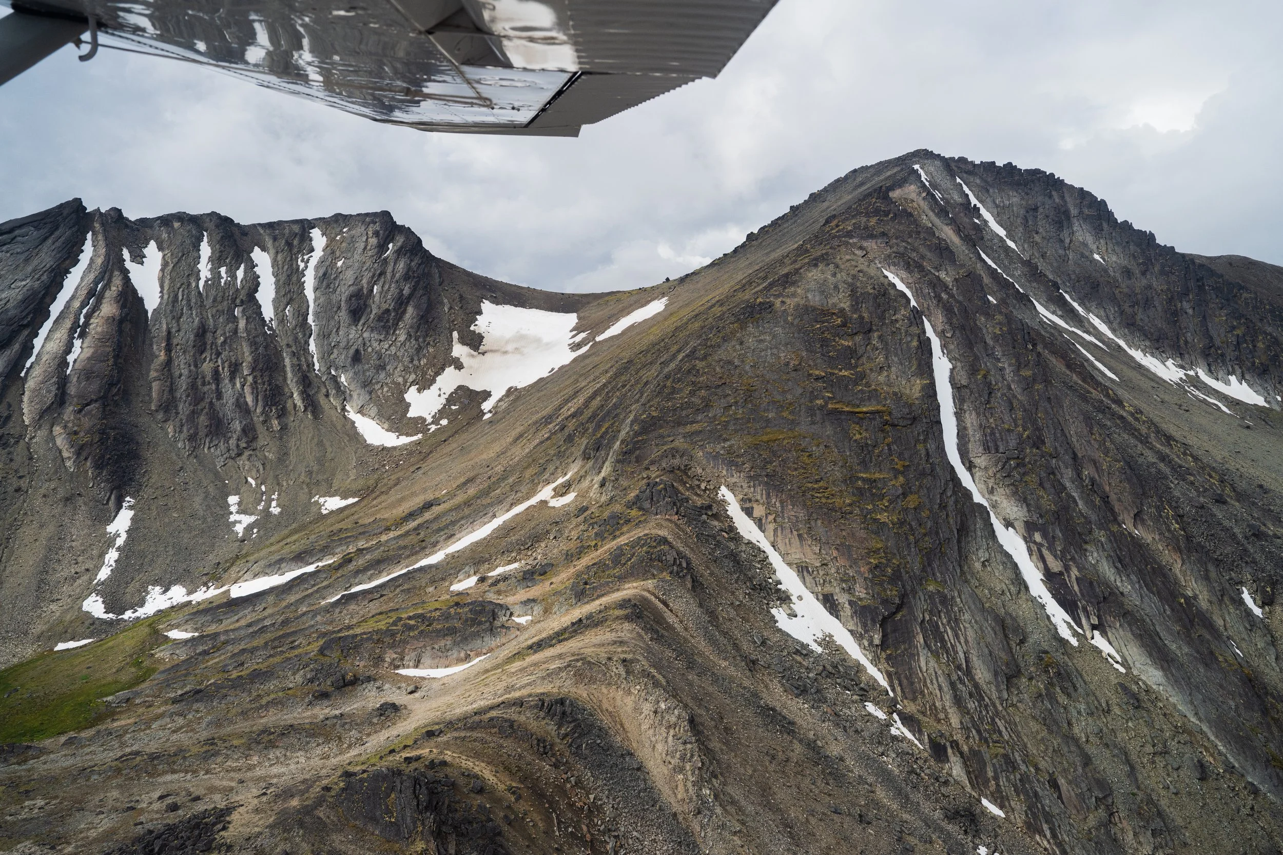 Rugged Mountainside captured from the window of a plane in Tatlatui Provincial Park, Northern BC