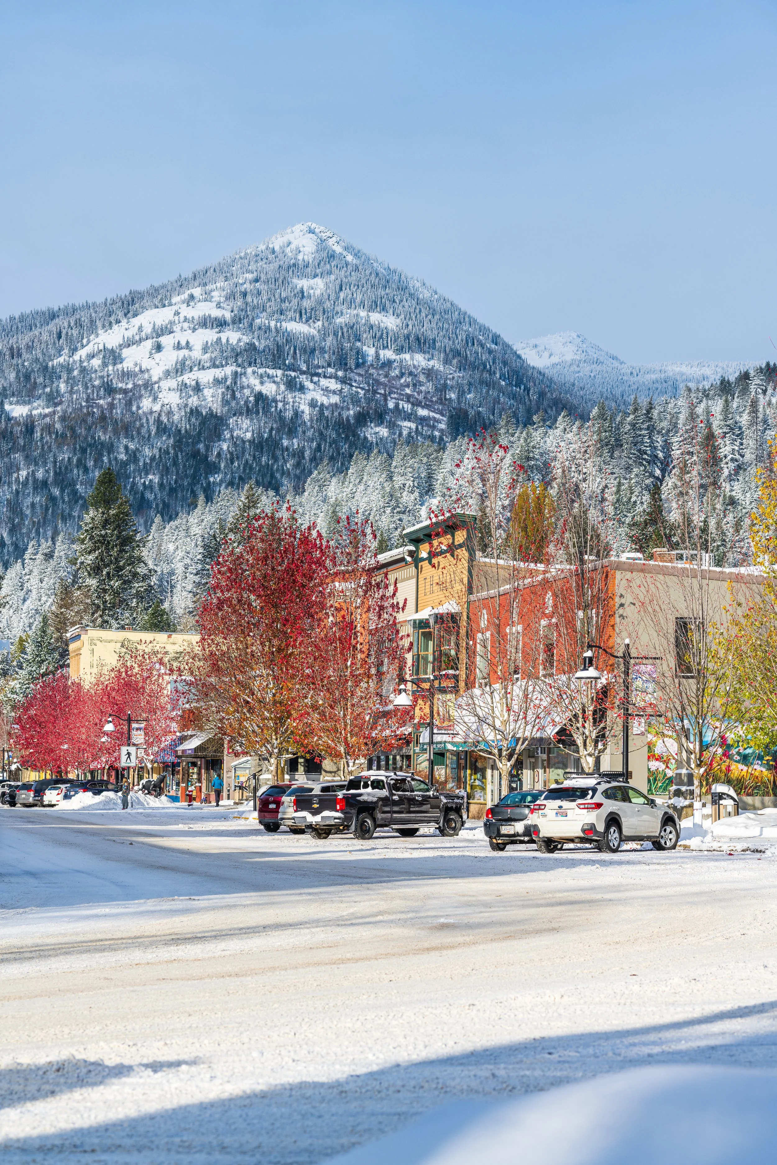 Fall and winter collide in downtown Rossland during a sunny day. British Columbia
