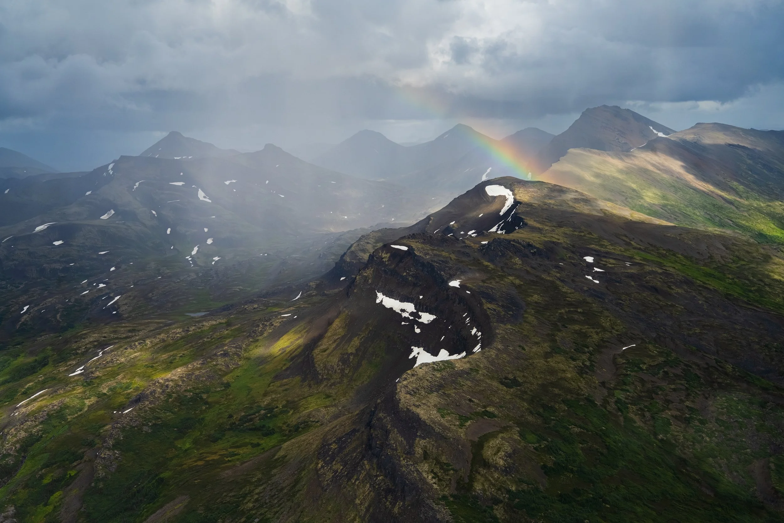A rainbow aerial image above Red Crag Mountain, in Tatlatui Provincial Park in the northwest of BC