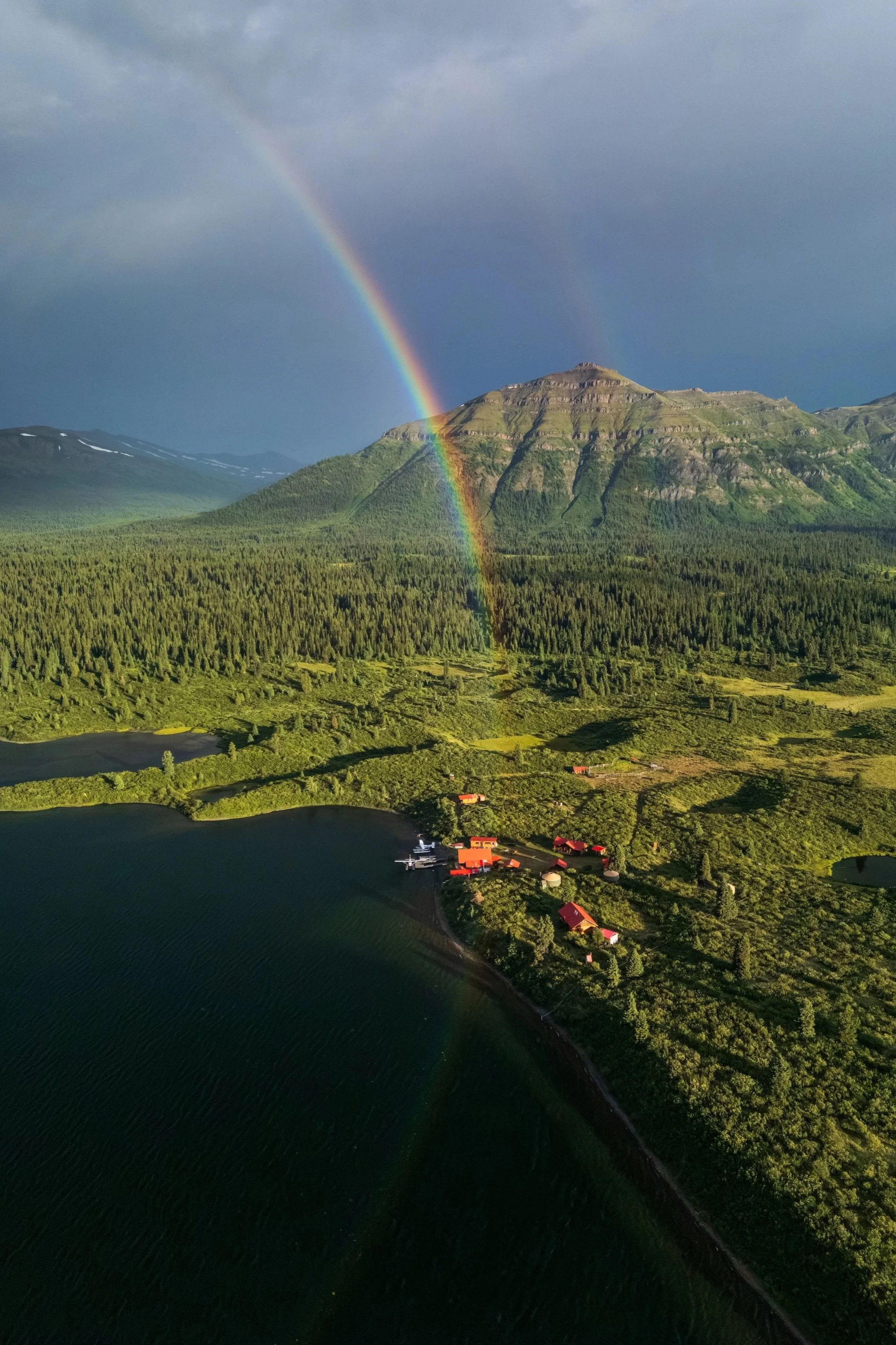 A rainbow rising up over Mt Terraze and Laslui Lake, in Spatsizi Plateau Provincial Park
