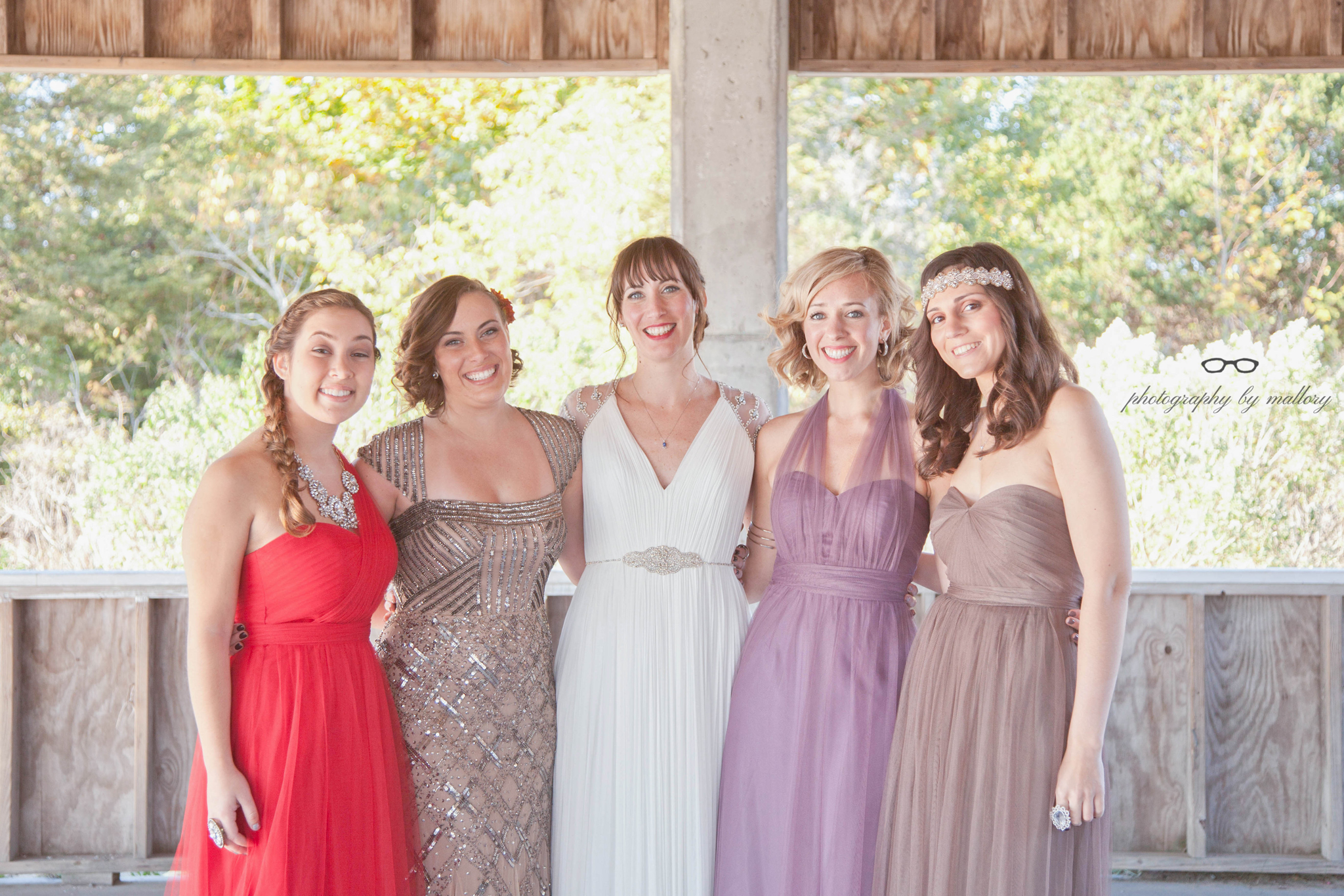 Fun fact: The three bridesmaid dresses (MOH is in sparkles) are all the same dress. The color and the tying of the sashes made them appear different. These are BHDLN dresses. 