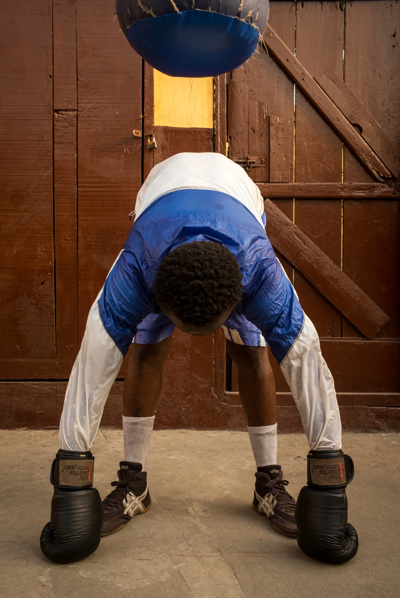 Samuel Lamptery, 19, stretching after training. 11 years of boxing: 9 Fights / 9 Victories