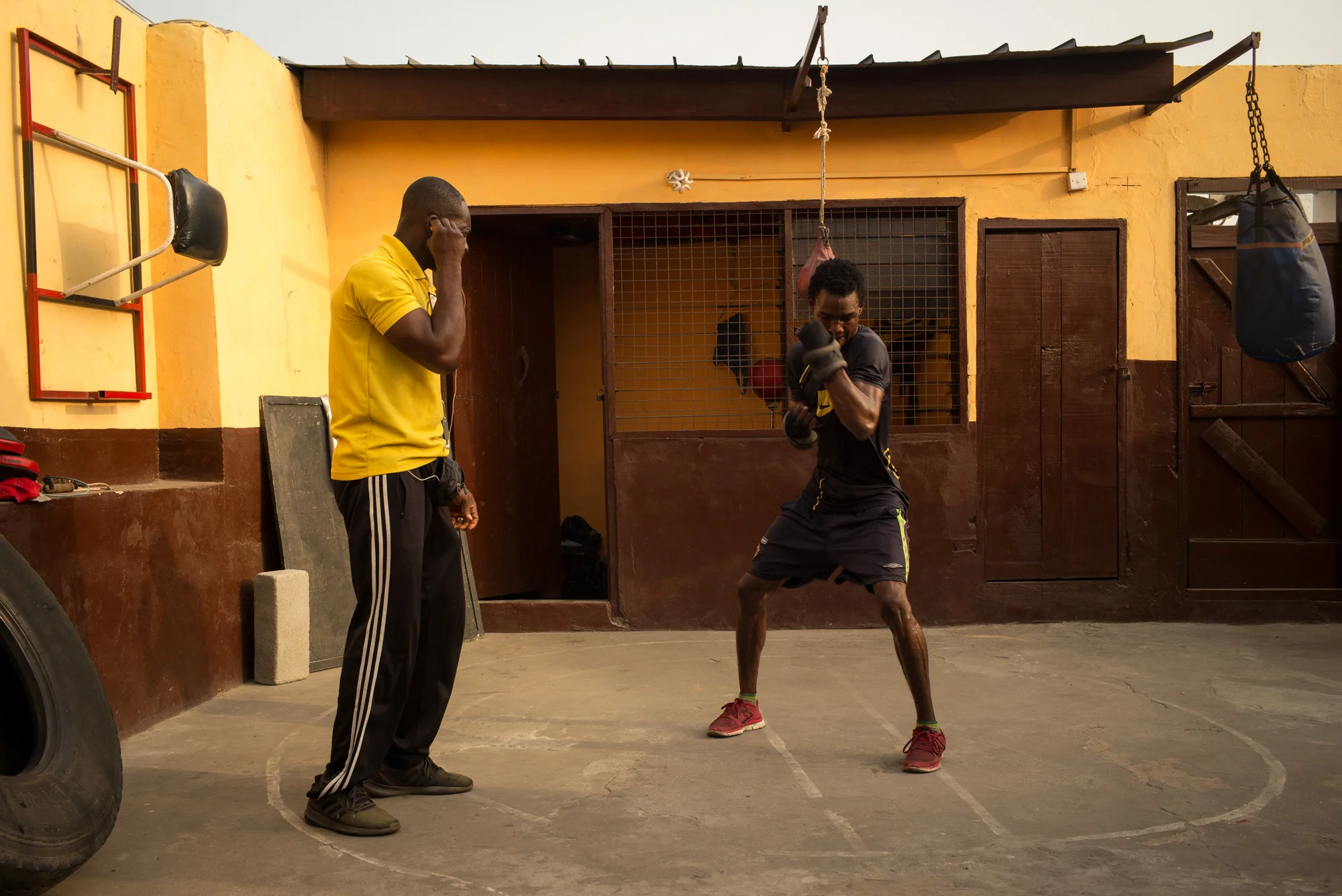 Theophilus Tetteh, 19, and his coach preparing for a fight Theophilus won on December 26th, 2018 - Discipline Boxing Academy, James Town