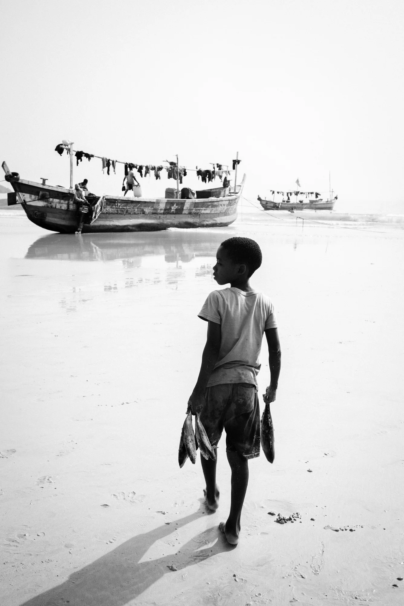 Boy with fish, Ghana 2018