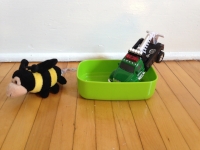 Bee turns away. Though he usually likes oatmeal, he doesn't FEEL like eating it. Truck, on the other hand, snarfs it down. 