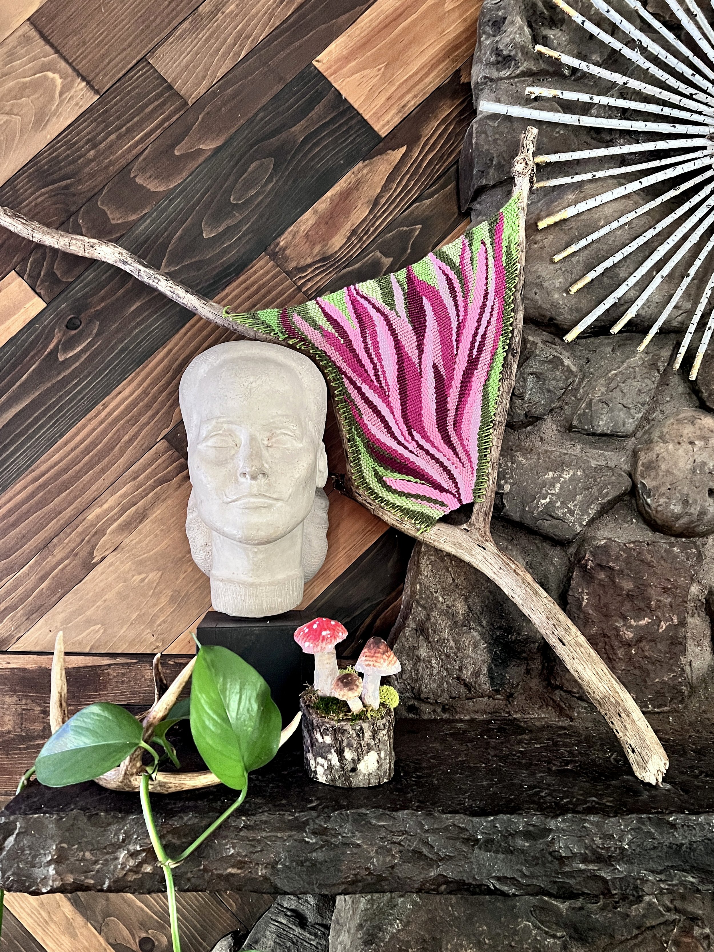  This piece was inspired by the flowers in my garden. Small brass nails hold the warp thread in place and sweet shades of pink wool is threaded through the string. 