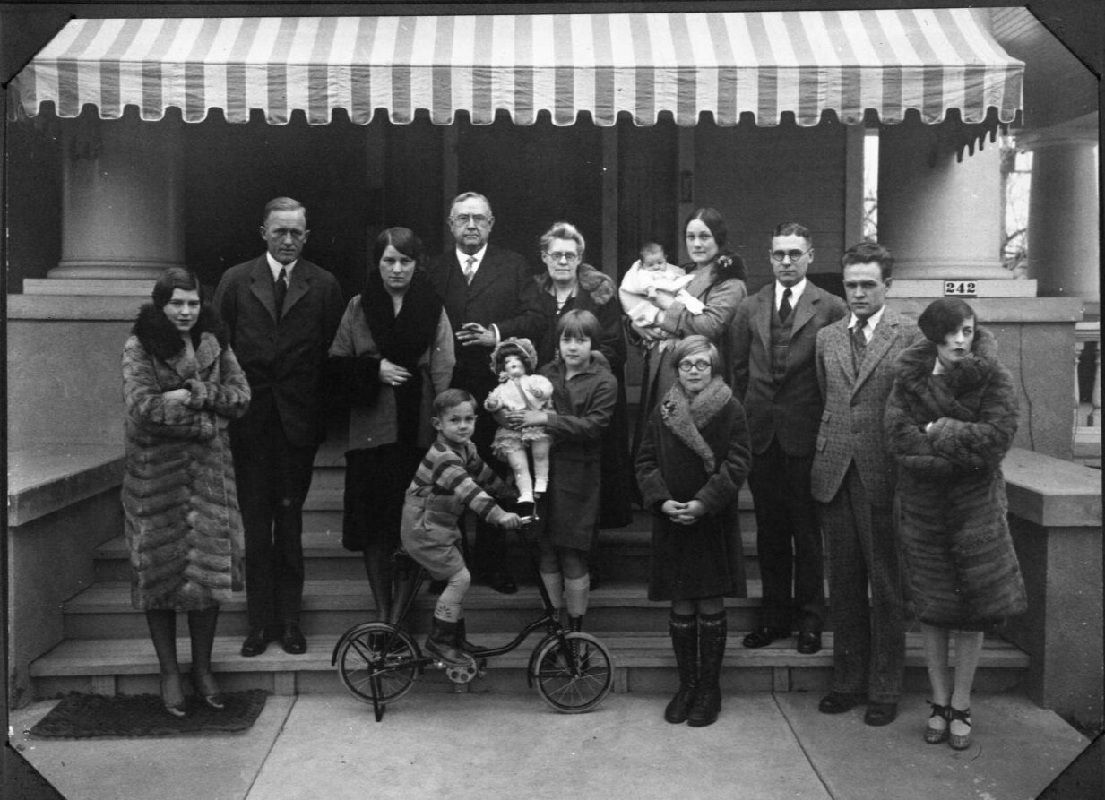  Family portrait of the Paxtons and Penders taken on the front steps at 242 Orange Street in Abilene, TX.  Pictured are George L. Paxton, Sr., Mattie Warren Paxton, Martha Pender, Hal Pender, Mildred Pender Deaton, Joy Pender Kutik, Helen Paxton Moor