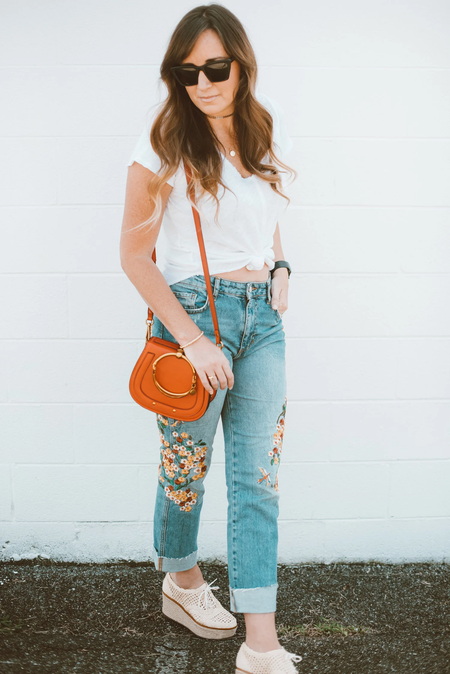 embroidered jeans and white tee
