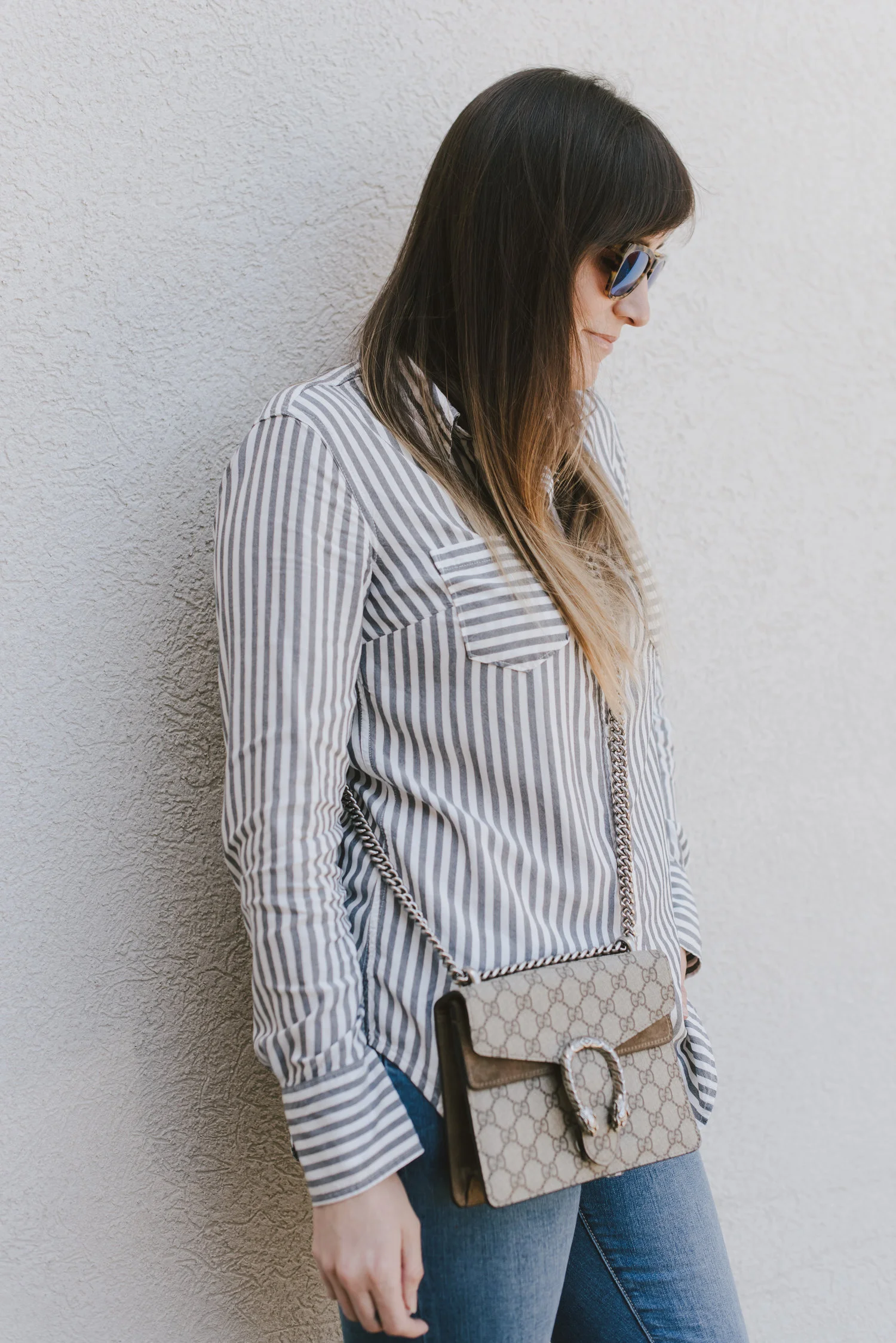 stripe button down and fringe jeans