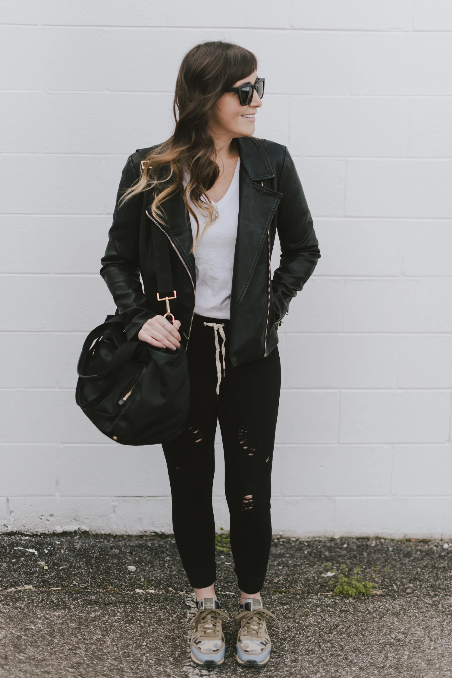 distressed black sweat pants and white tee