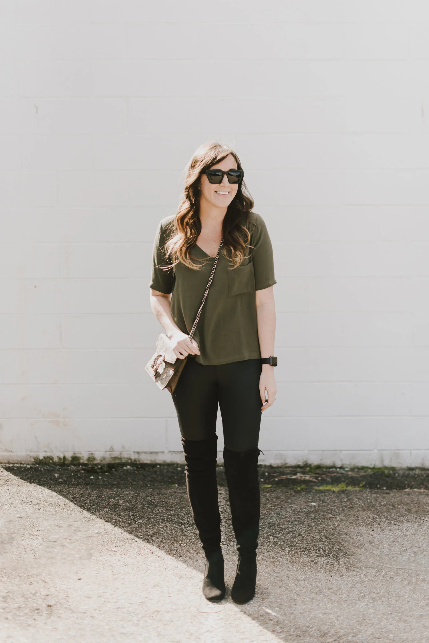 green silk shirt and over the knee boots
