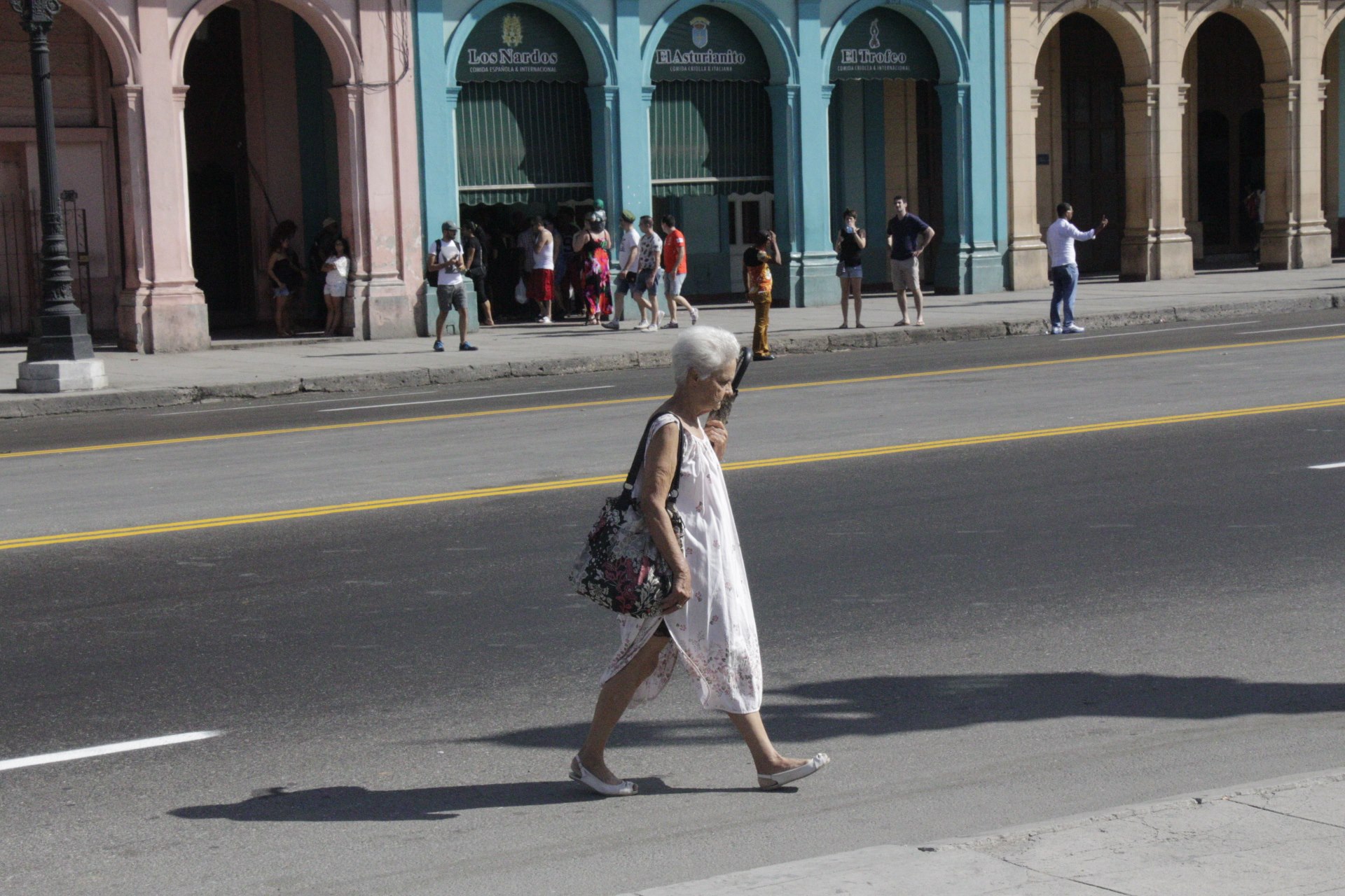   The stark imagery of Cuba is contrasted by the muted clothing of locals. With so many in poverty, the bare essentials were more norm, even in more elegant neighborhoods.  