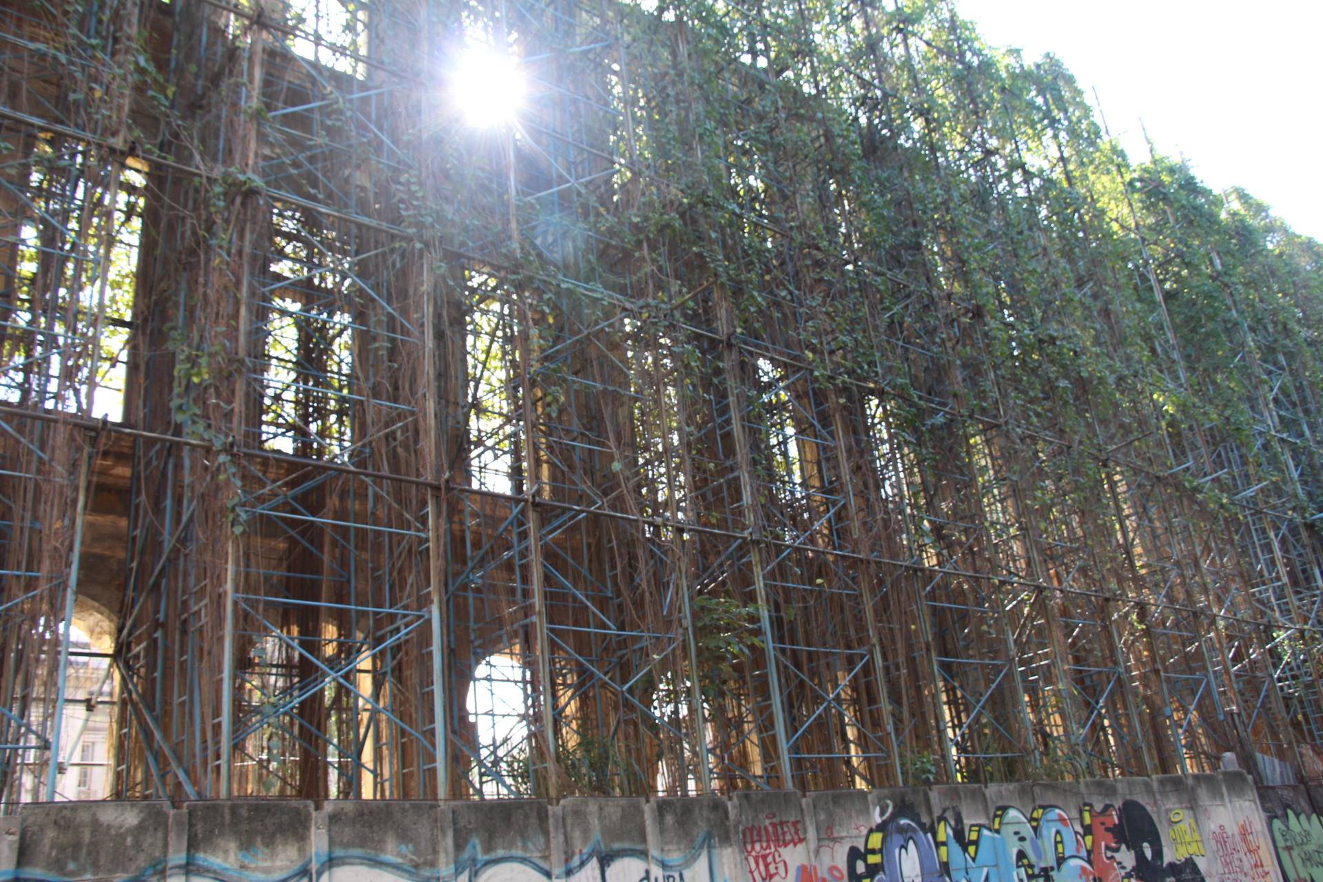   It seems everywhere is under construction. But on closer inspection, many of these construction sites are really just about supporting the structures from falling down. How long has this been up there such that such ivy has grown into it? The cultu