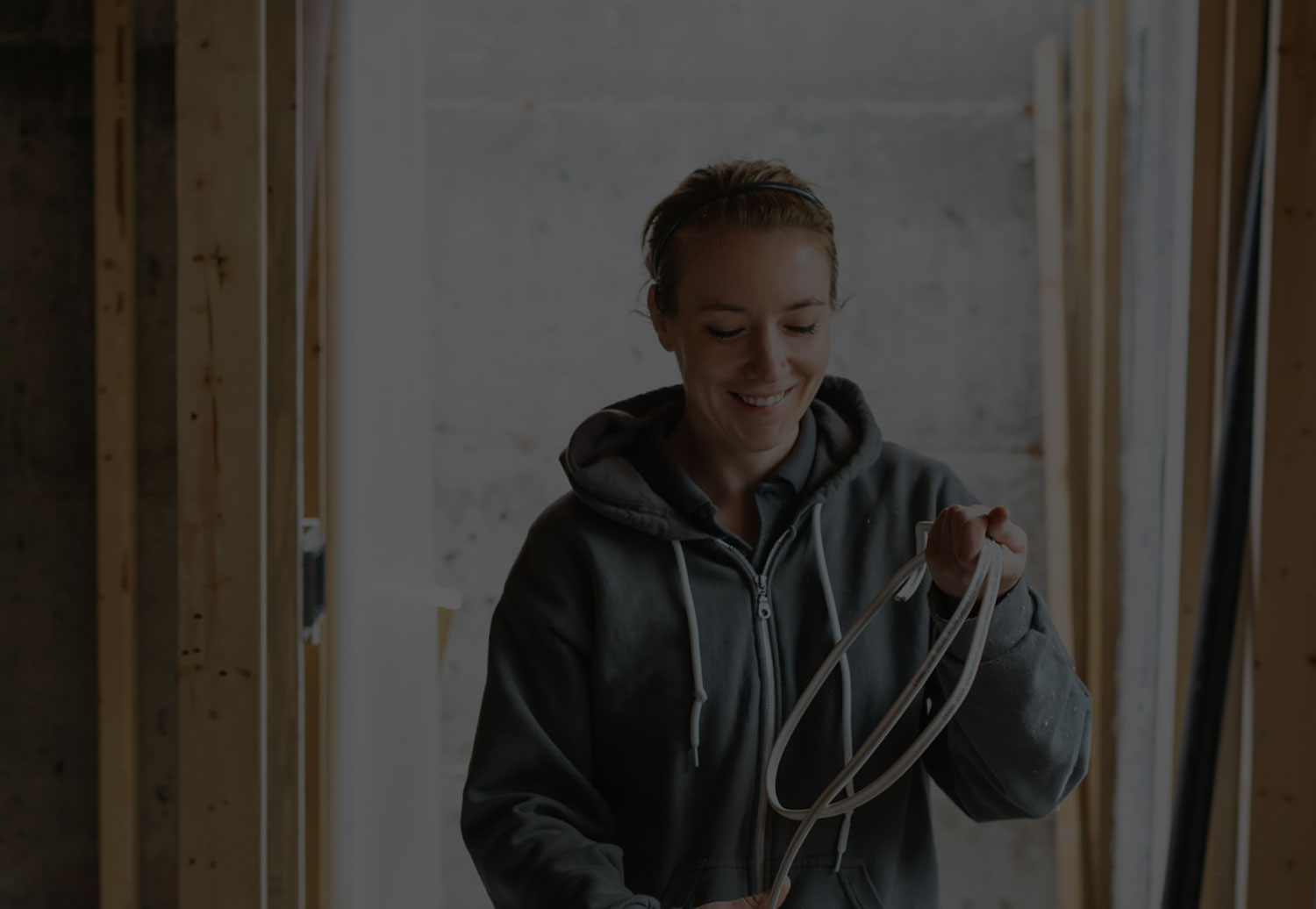 Young Electrician Woman Working On The Job