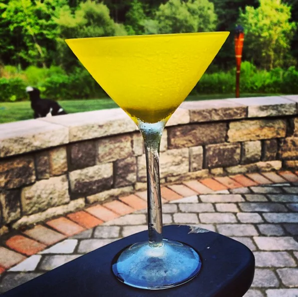 Martini, Plymouth gin, stirred while thinking smooth thoughts, dry as the dust under your bed, with a twist, served up or not at all. Yellow Ideasicle glass is optional.