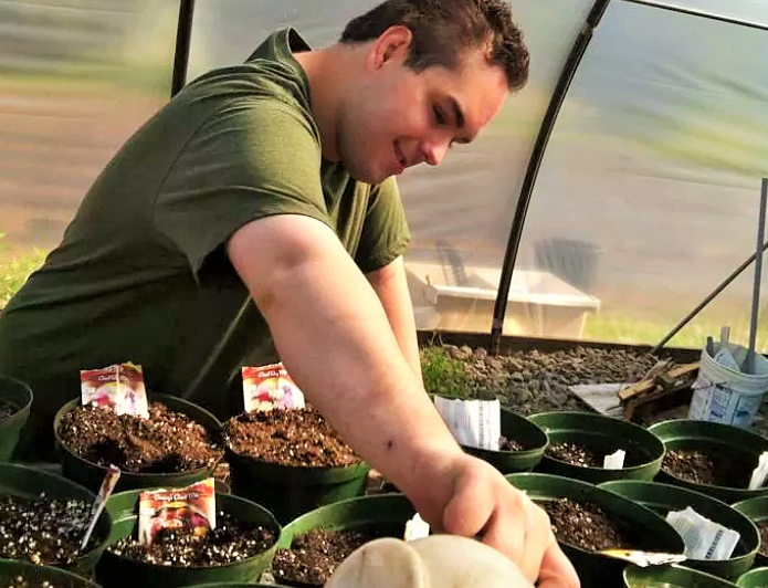 Founding Farmer Charles "Chucky" Brongo working in the greenhouse