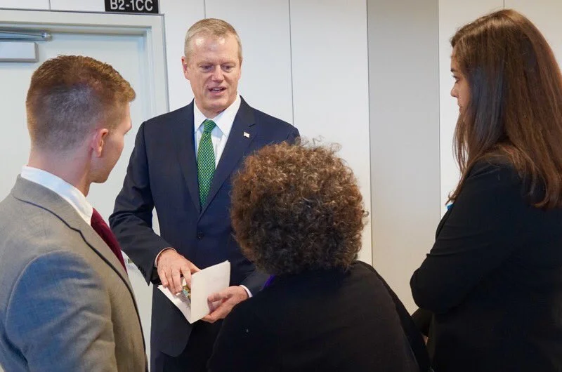 Mothers out Front confront Baker at the airport