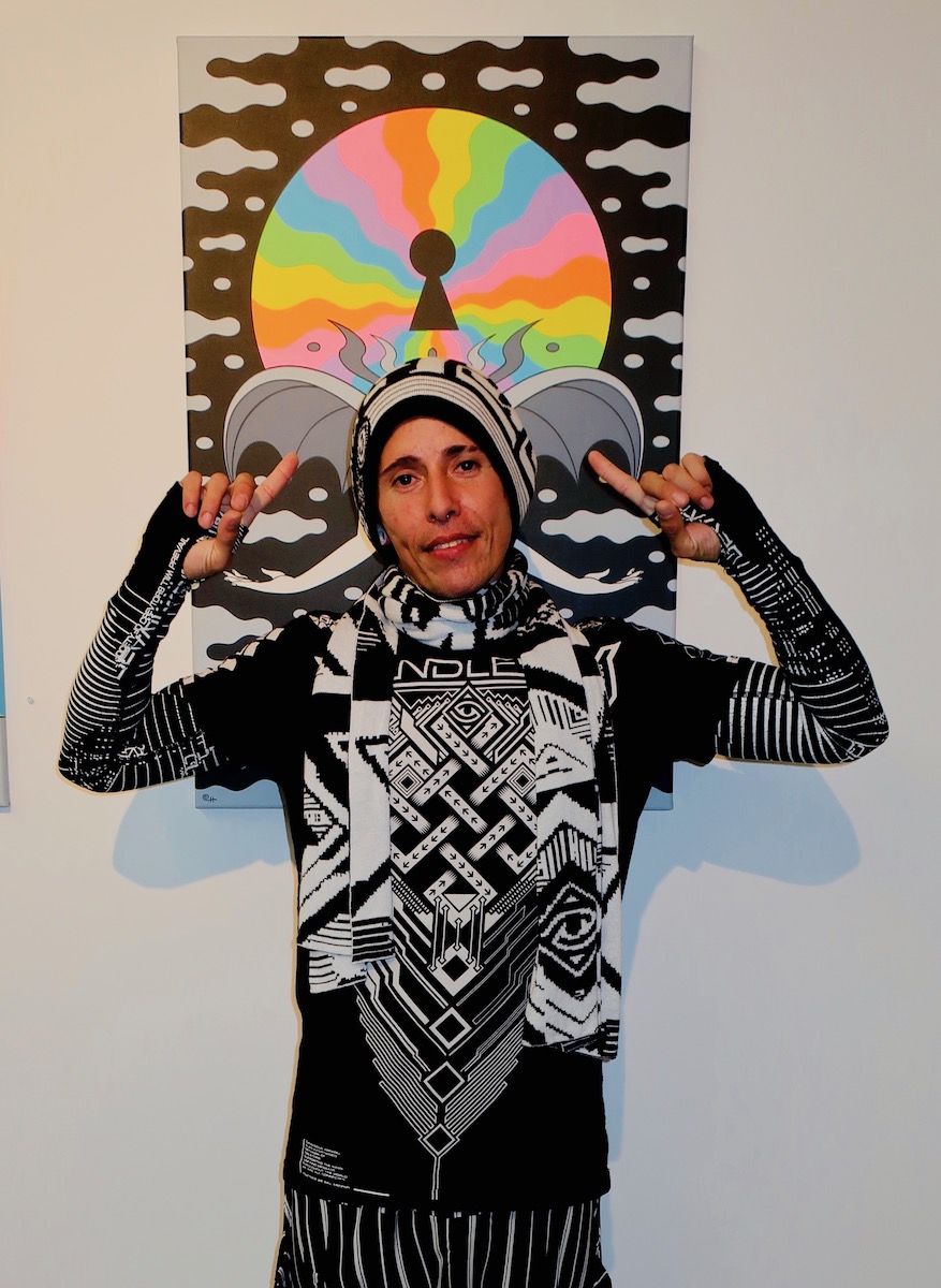 At Corey Helford Psychedelia Group Show with Carlos Lopez ((cel11scorpio) in front of Oliver Hibert painting