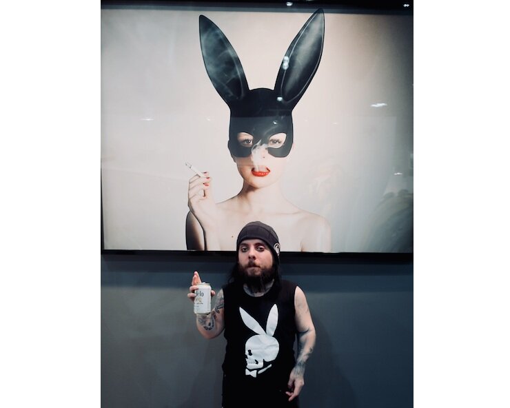 LA Art Show 2018 Nik Sin in front of Tyler Shields piece at Samual Lynne Galleries