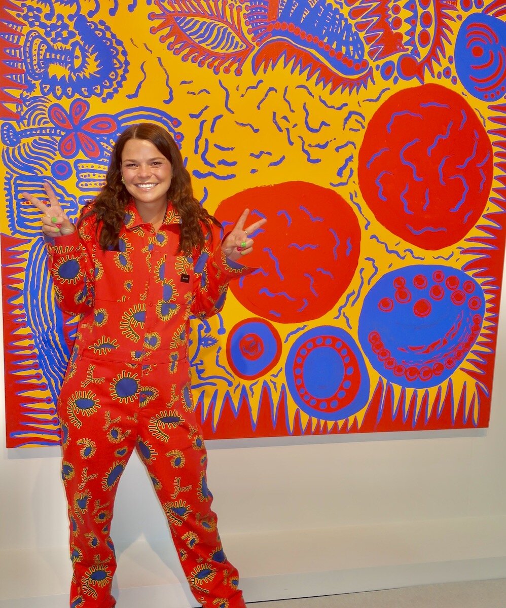 The Armory Show with Ashleigh Hill standing in front of Yayoi Kusama painting at Victoria Miro Gallery