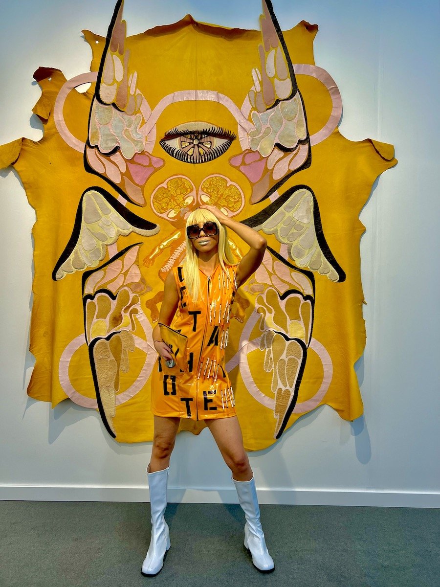 Spotted at Frieze LA with Wynter Alana in front of Tau Lewis skins at Night Gallery