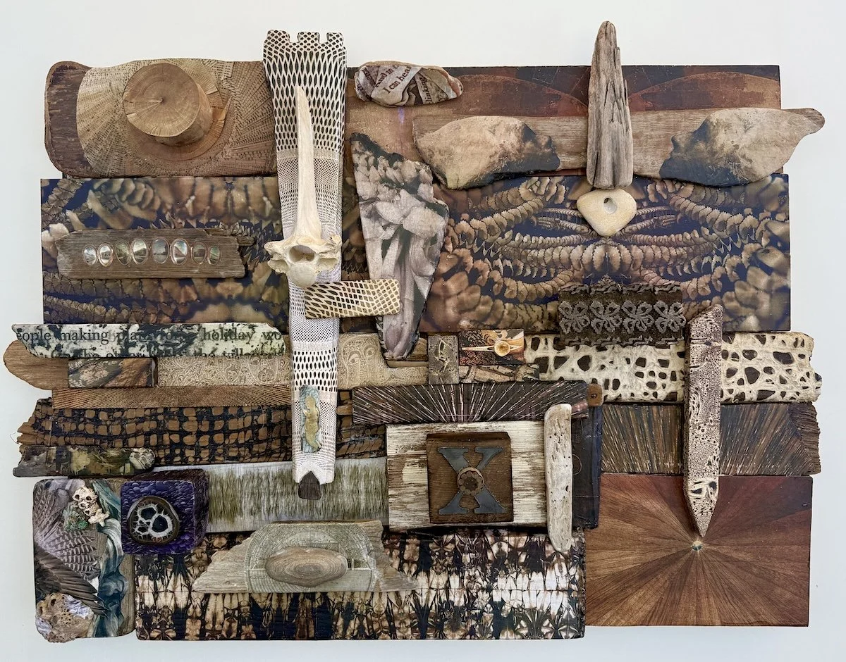  30 × 40 collage driftwood, bones, barnacles, rubber stamps, stones, slice of vintage cable wire.  