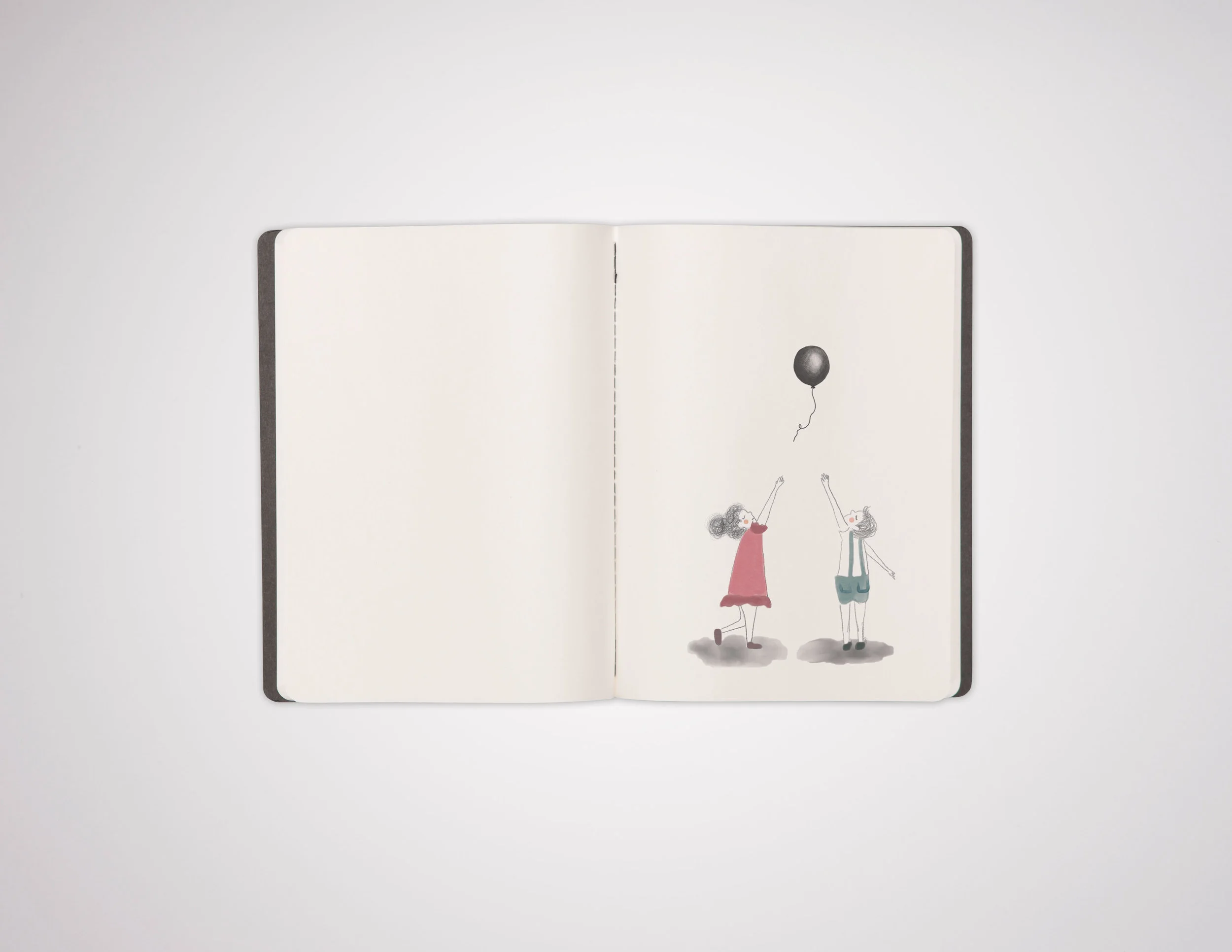 BlackMoleskinNotebookOpen.jpg