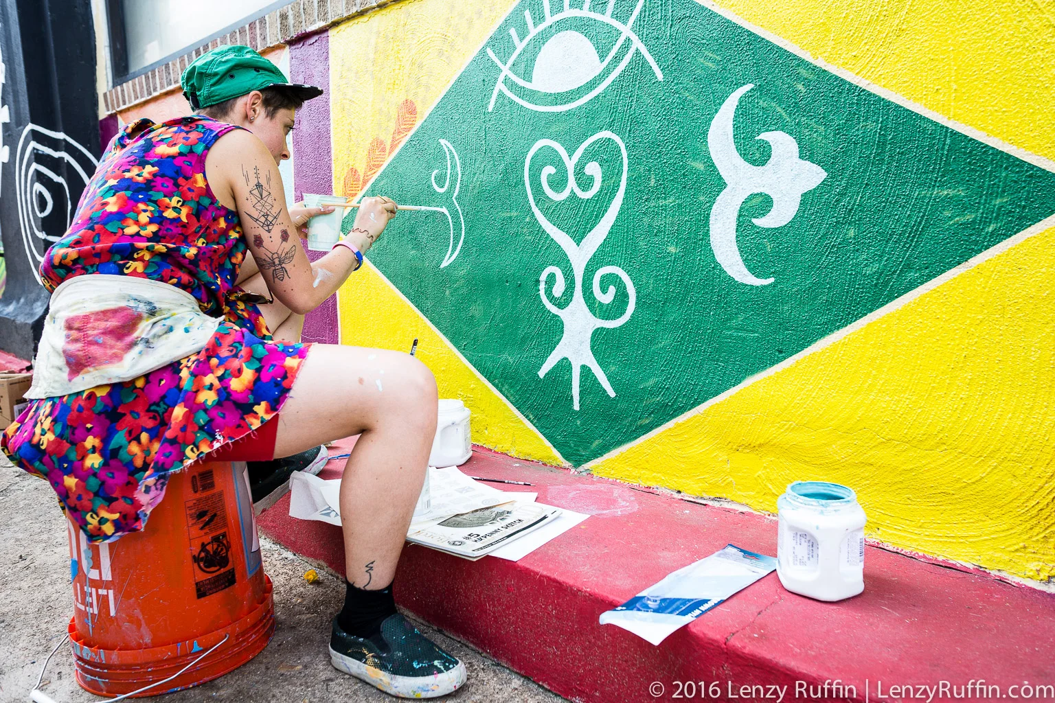 Rose Jaffe (@rose_inks on IG) beautifying the wall in front of Hands On Drums DC.