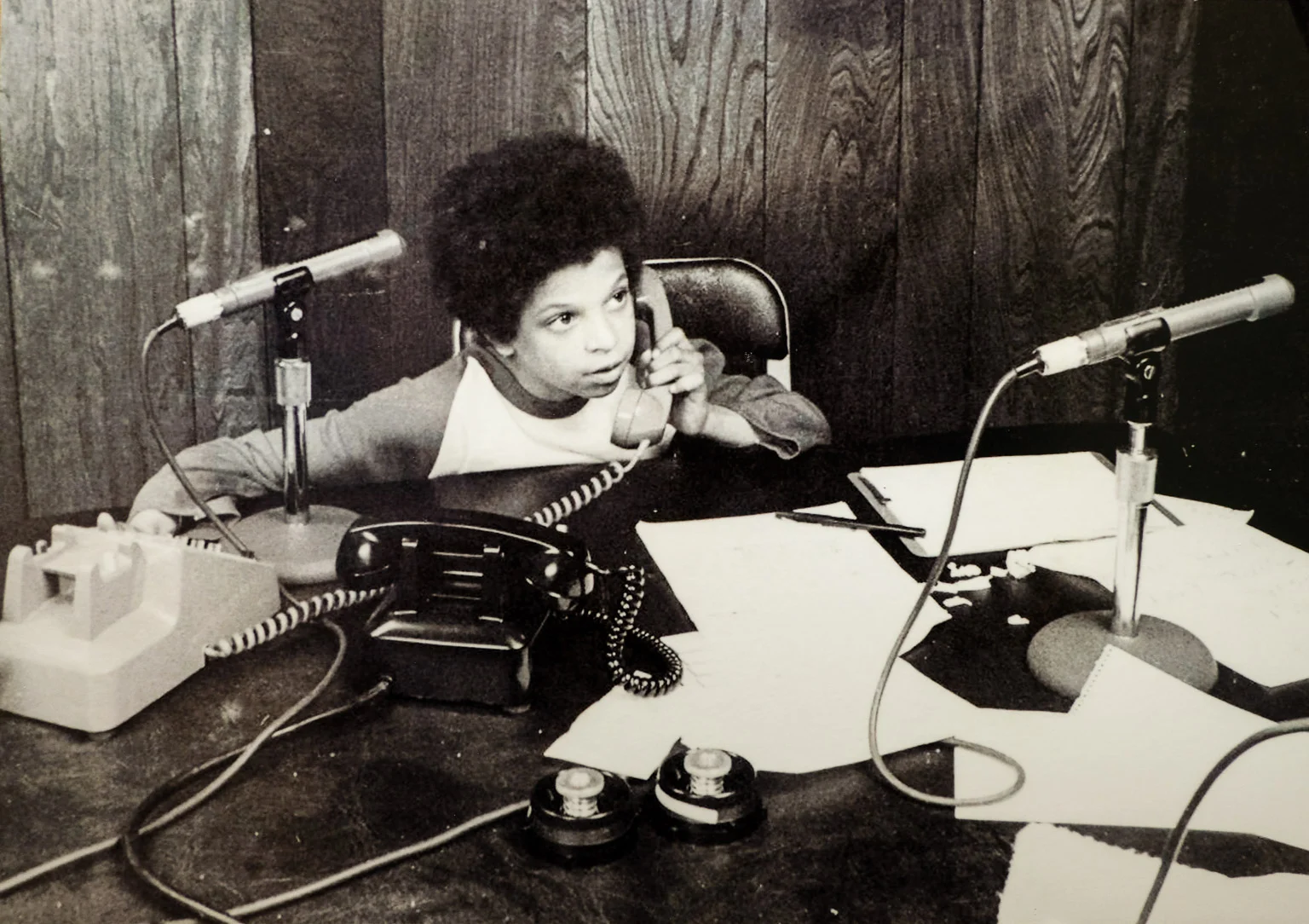A young Alfred Liggins working the phones at WOL.