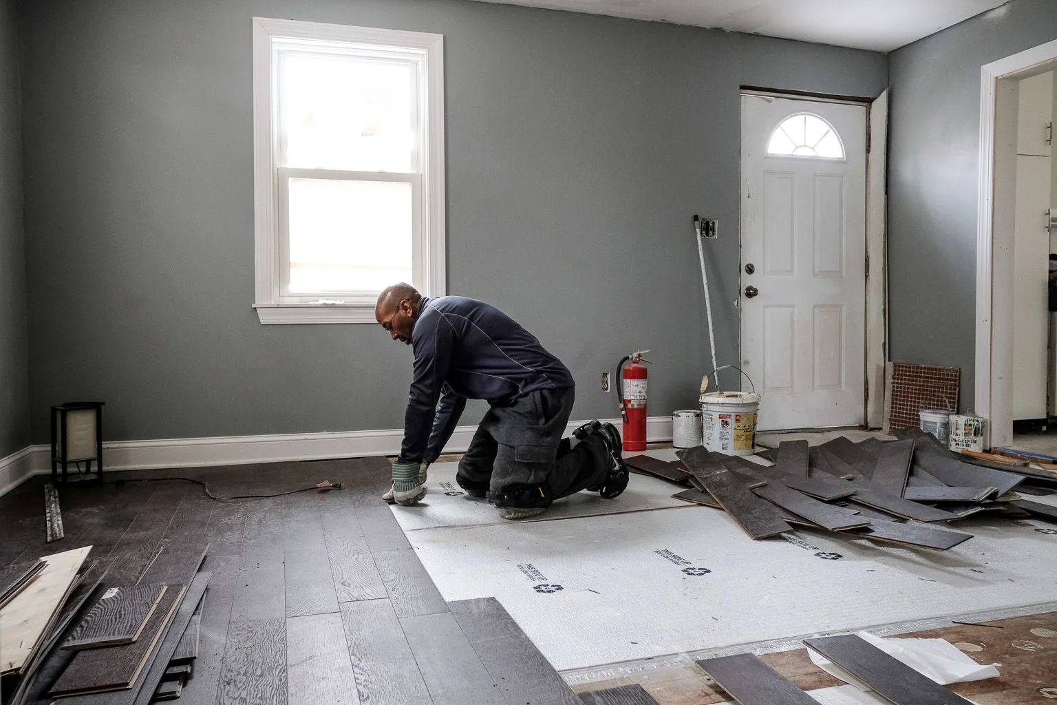 This is me uninstalling the hardwood floor after I fired the contractor I started the project with. That's a long story for another blog post. I had to remove the floor because they did such a poor job of installing it. This was the least of their shabby work that had to be redone.