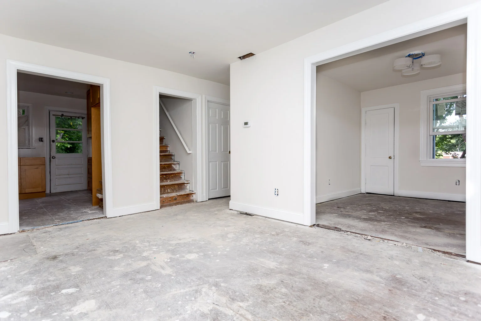 This is the first floor now. The hardwood I took up is stacked up in my basement to use on a future project. For this house, carpet will be the floor treatment.